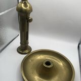 Candle holder with a pusher