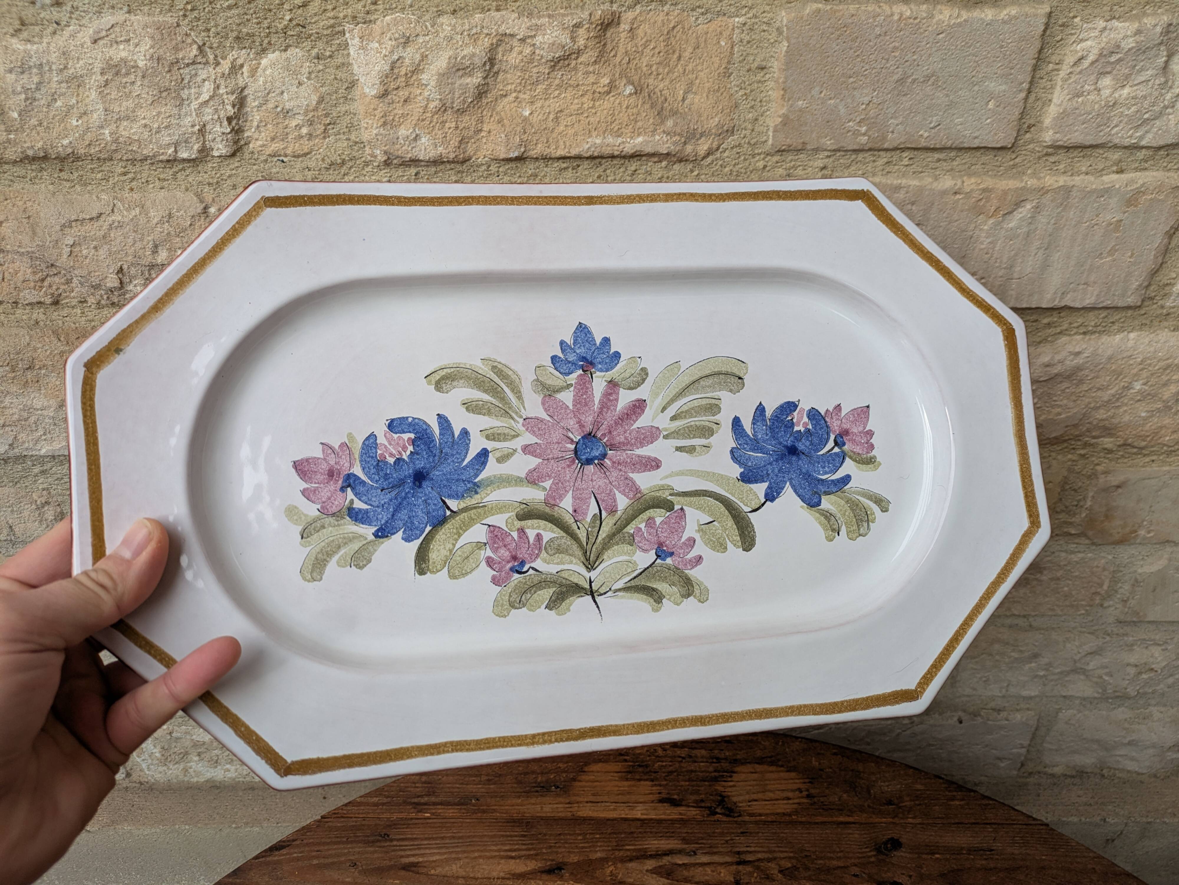 Rectangular earthenware dish with a glazed finish, decorated with a bouquet of flowers.