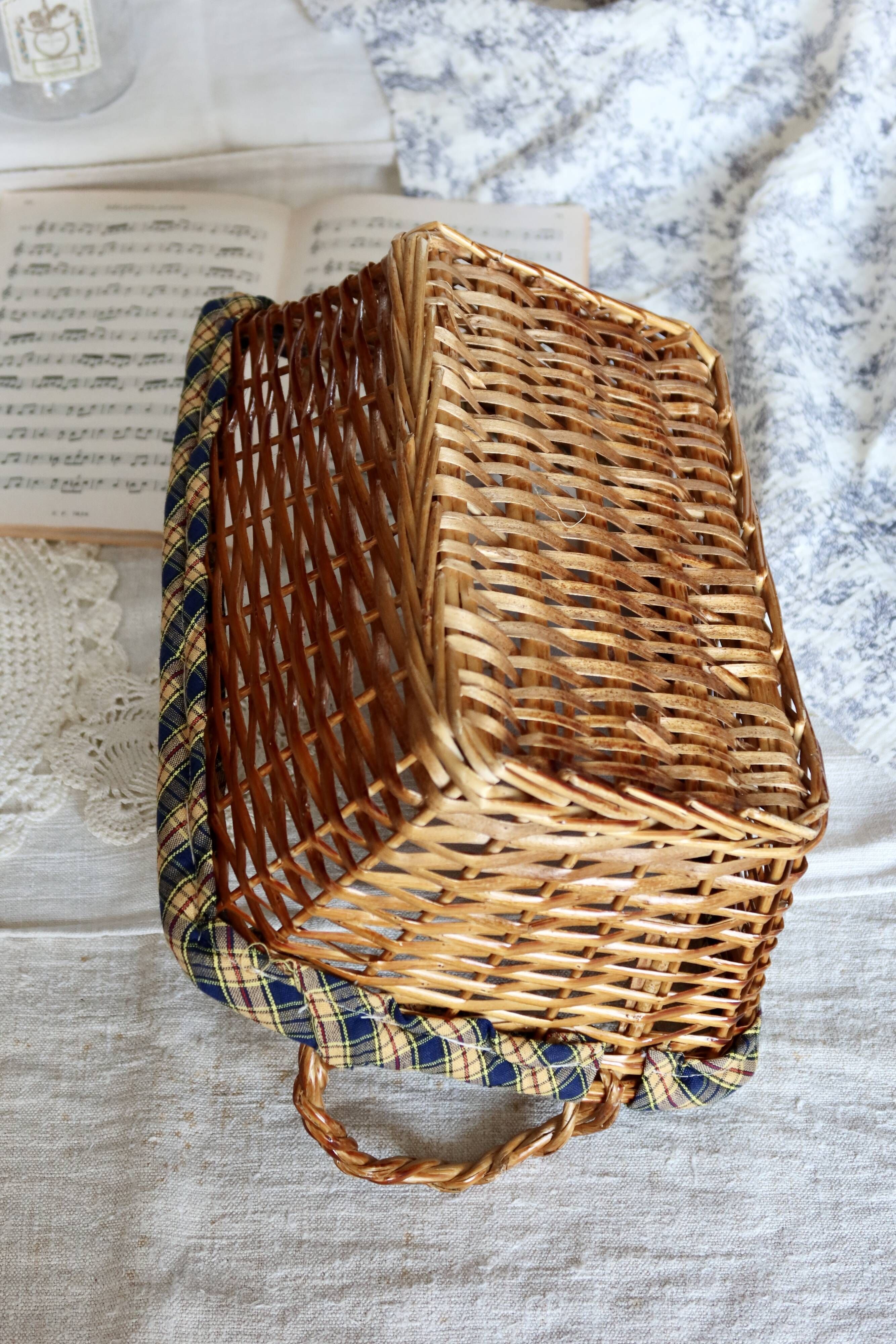 Vintage wicker basket with blue and yellow checkered lining