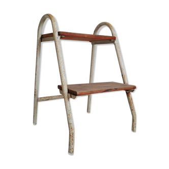 Ancient patinated metal and wood ladder