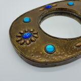 Brass oval mirror and blue cabochons