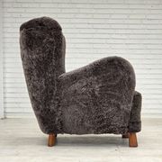 Années 1960, design danois, fauteuil rembourré, véritable peau de mouton.