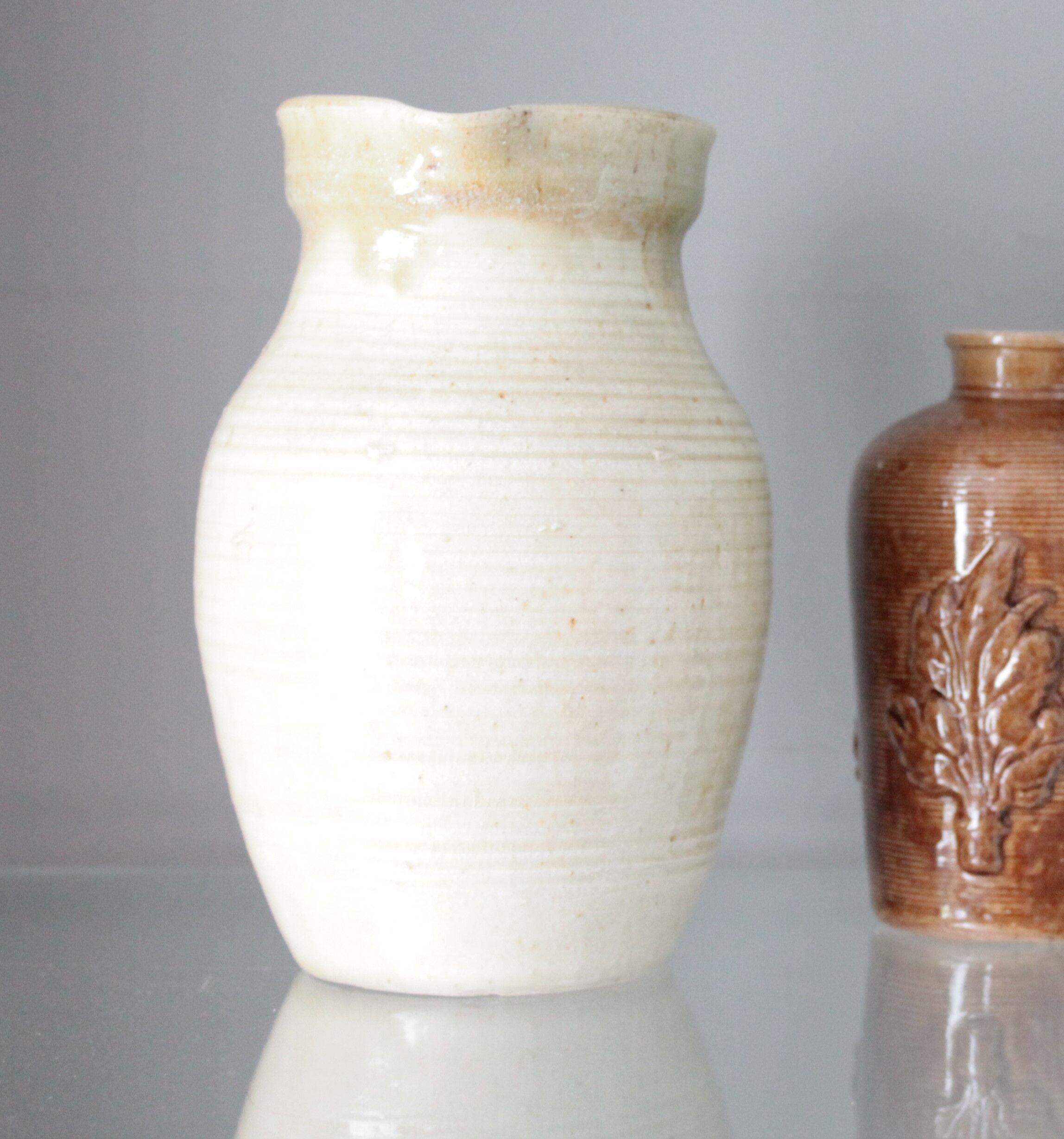 Old decanter in enamelled sandstone