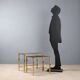 Nested tables in brass and smoked glass.