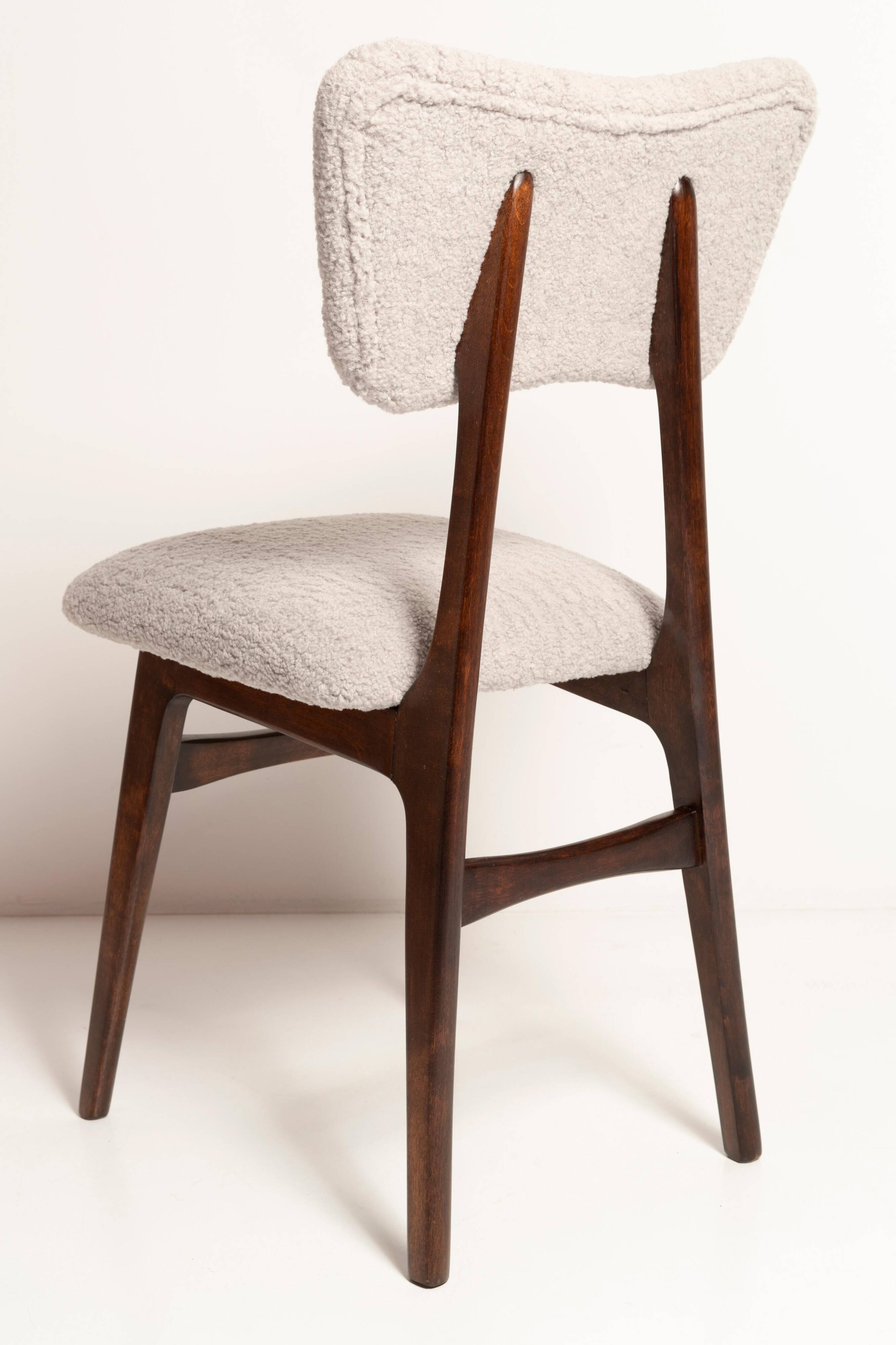 Mid-century butterfly chair, light grey boucle, dark walnut wood, Europe, 1960s.
