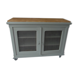 Vintage buffet on grey green wheels, 2 glass doors, wooden tray.