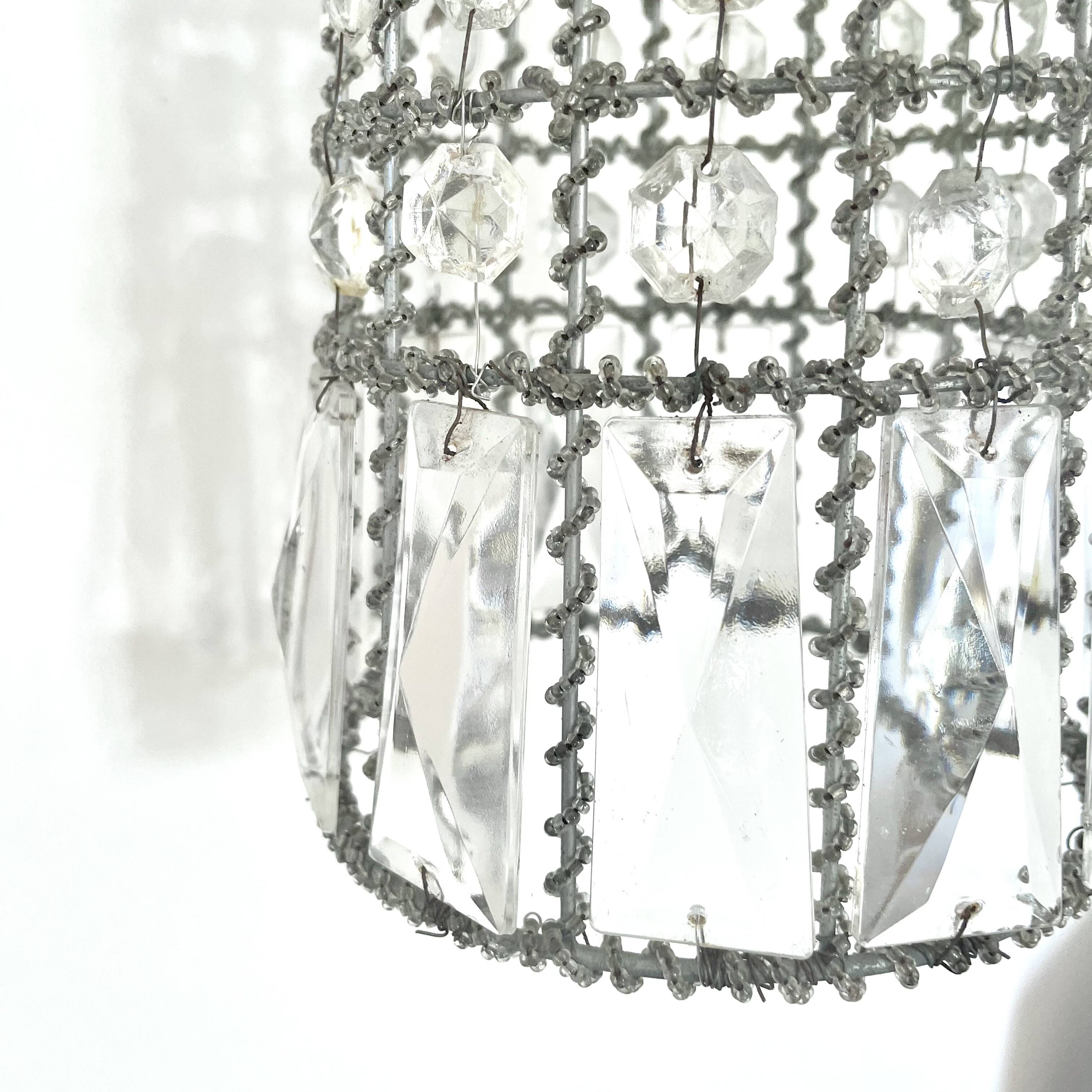 Suspension in old glass beads