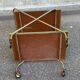 Mid-Century 1978 brass and black smoked glass wheeled dessert trolley.