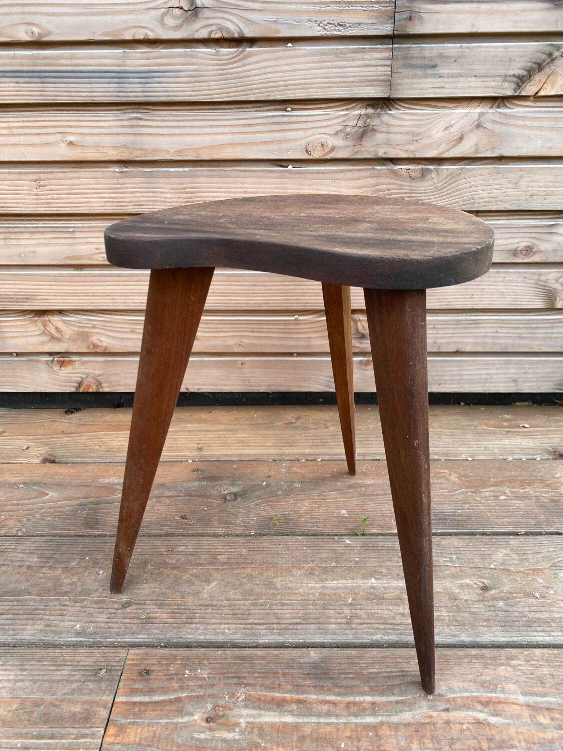 Teak stool in a bean shape
