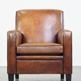 Fauteuil design en cuir de mouton vintage confortable avec un look robuste