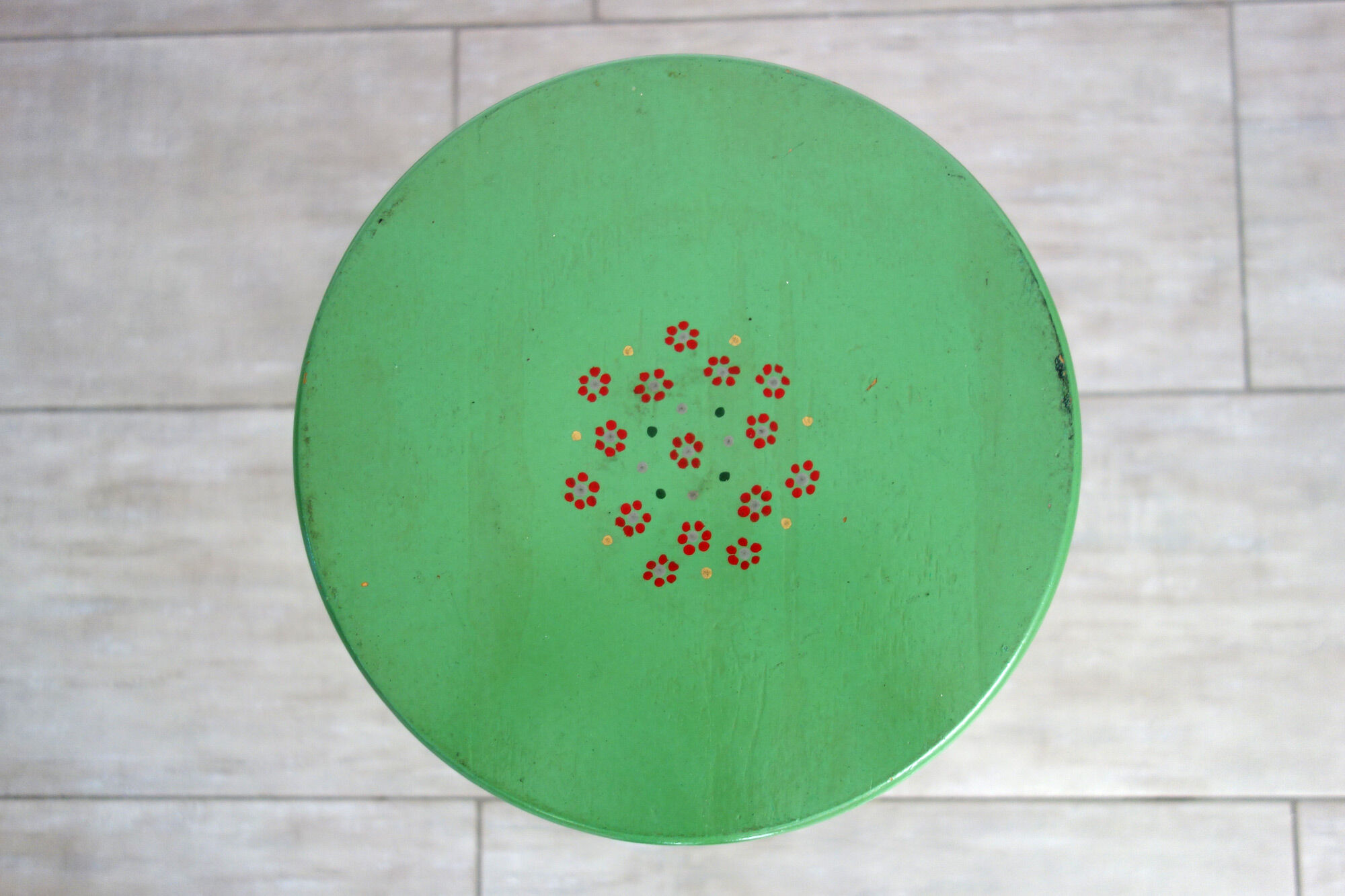 Old painted and decorated wooden stool