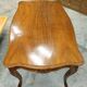 Curved desk in Louis XV style, made of carved and moulded walnut.