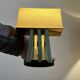 Pair of Hollywood Regency wall lights, bases & reflectors in gilded brass