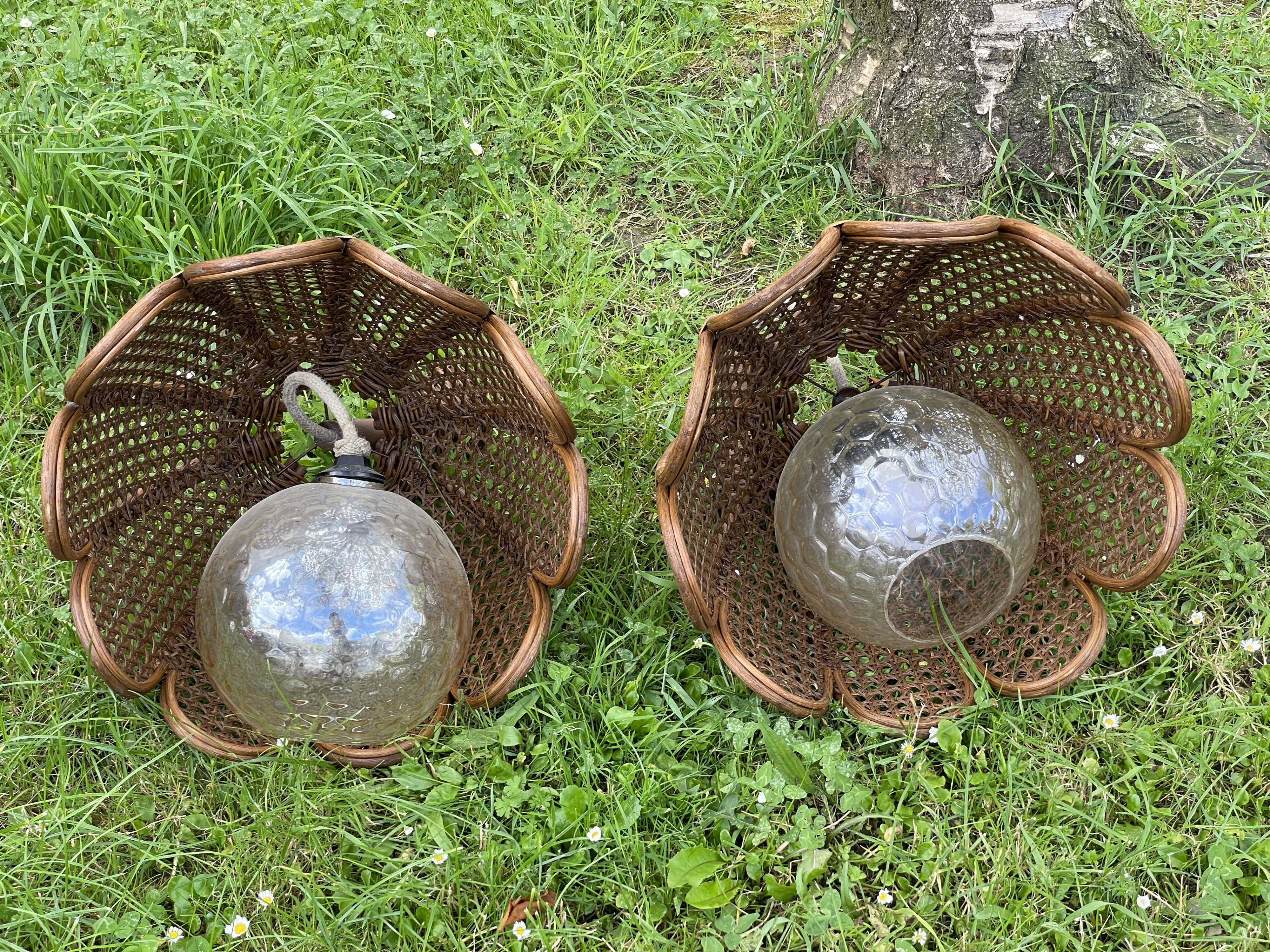 Duo of rattan and glass chandeliers