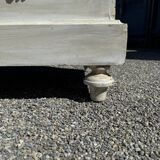 Old chest of drawers in bleached wood with white marble top