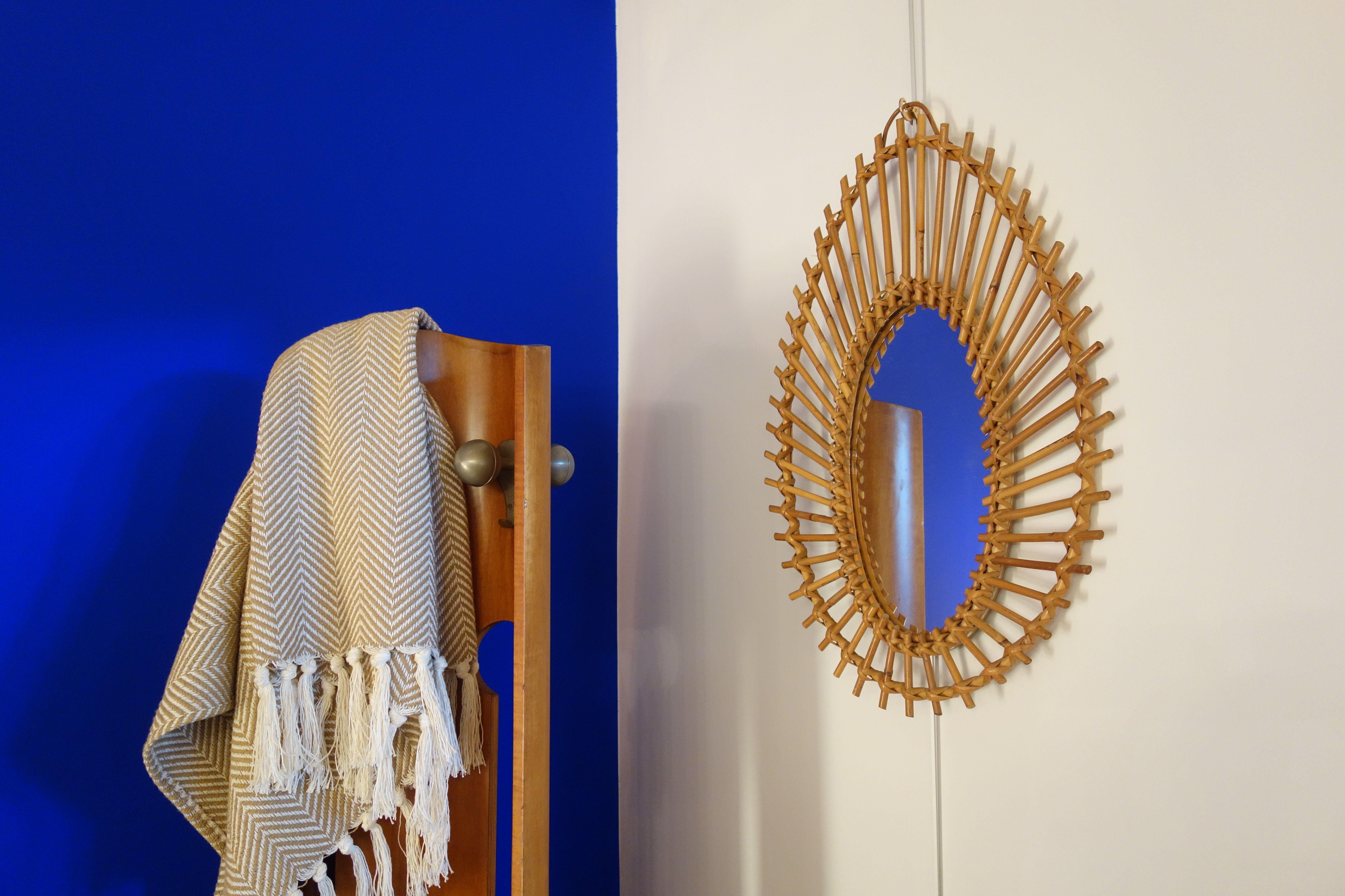 Free-form sun mirror in 60s rattan