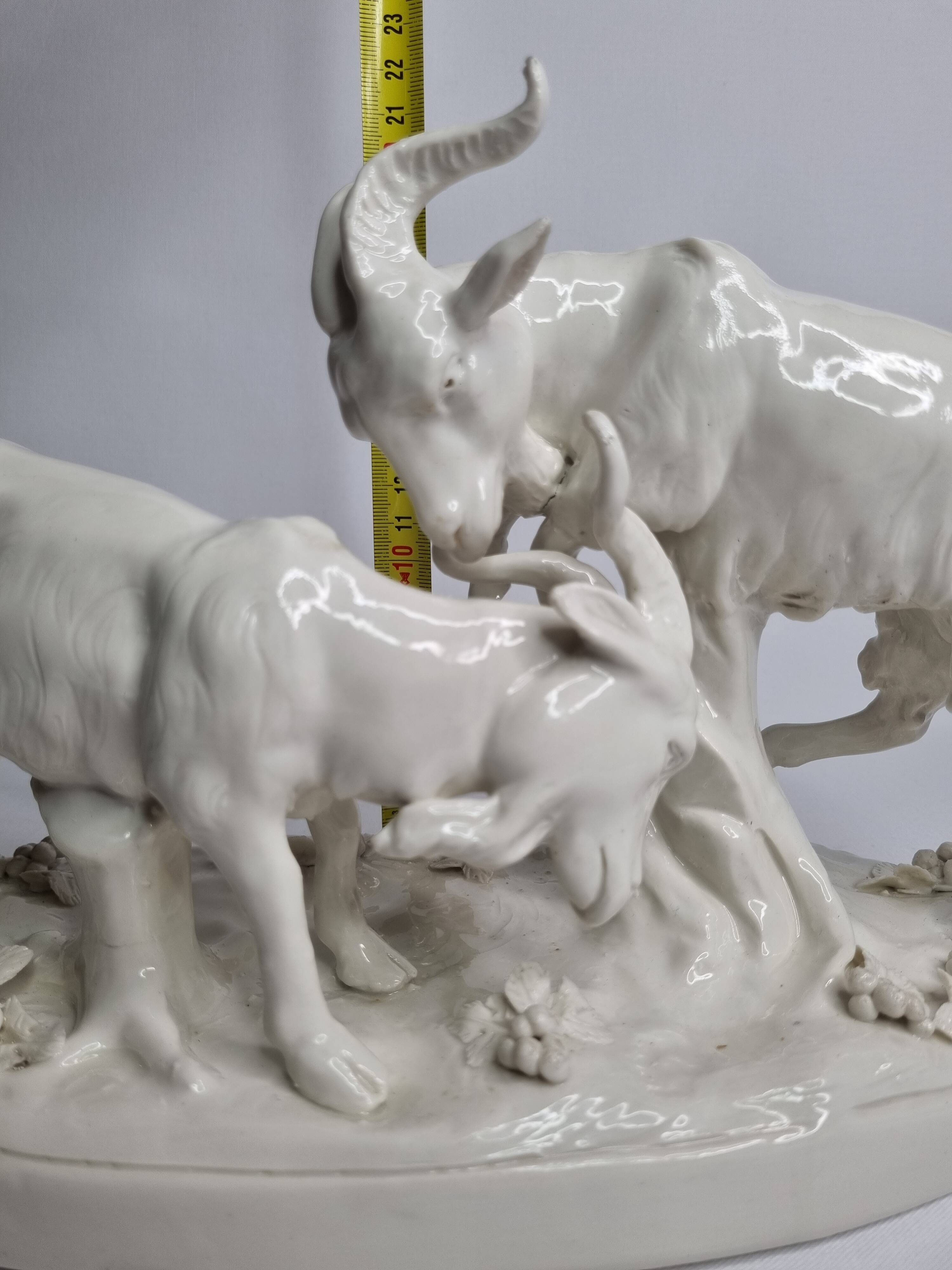 Saxon porcelain group, two fighting goats, signed Röhle, 1900