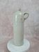 Antique beige glazed stoneware bottle from the 19th century, with a handle, vintage decor.