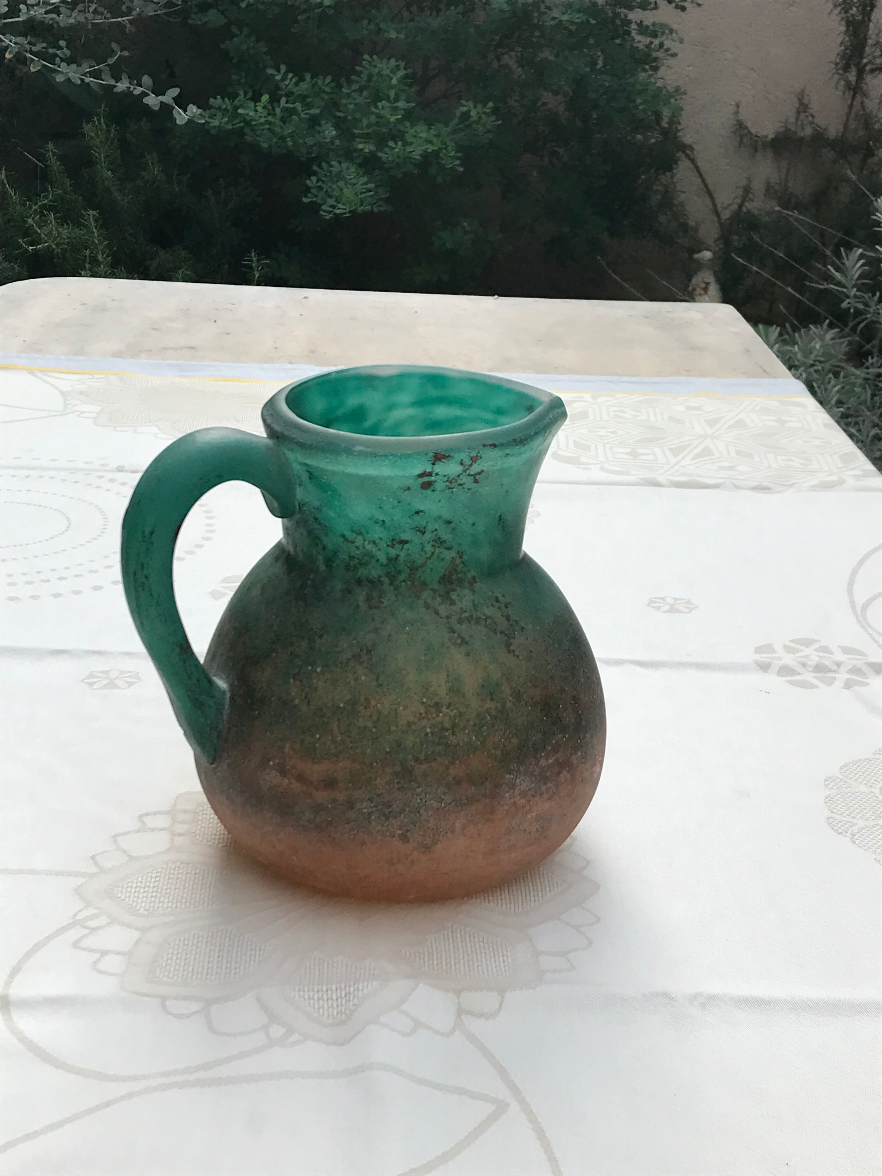 Orange and green glass paste pitcher by Georges DE FEURE