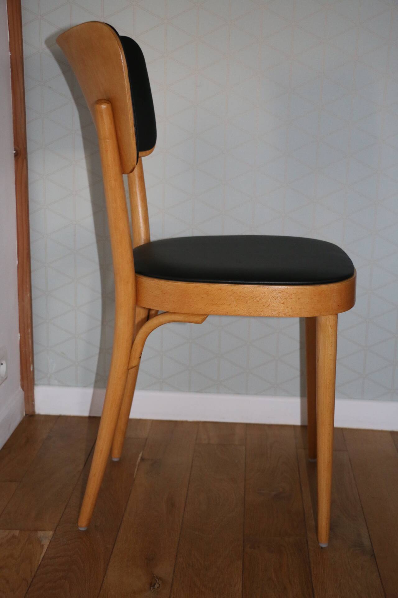 5 baumann chairs with large backs in black faux leather.