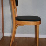 5 baumann chairs with large backs in black faux leather.