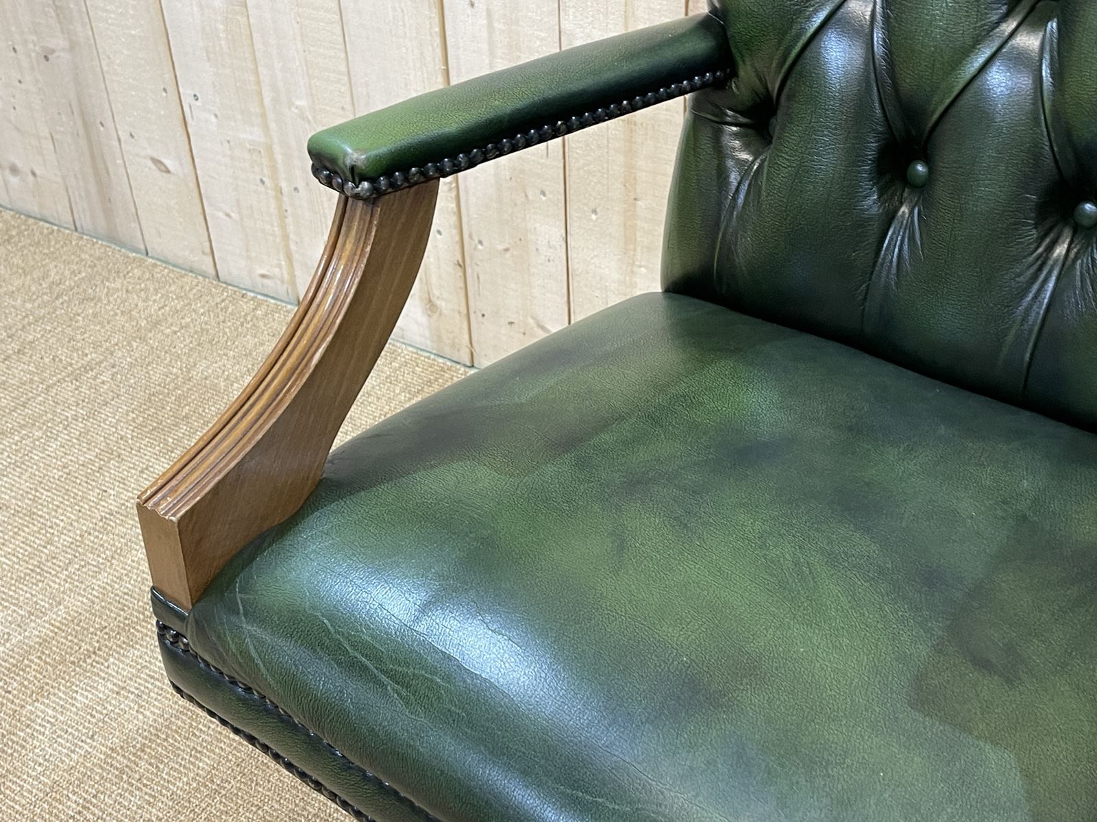 English chesterfield office armchair in green leather from the 1980s