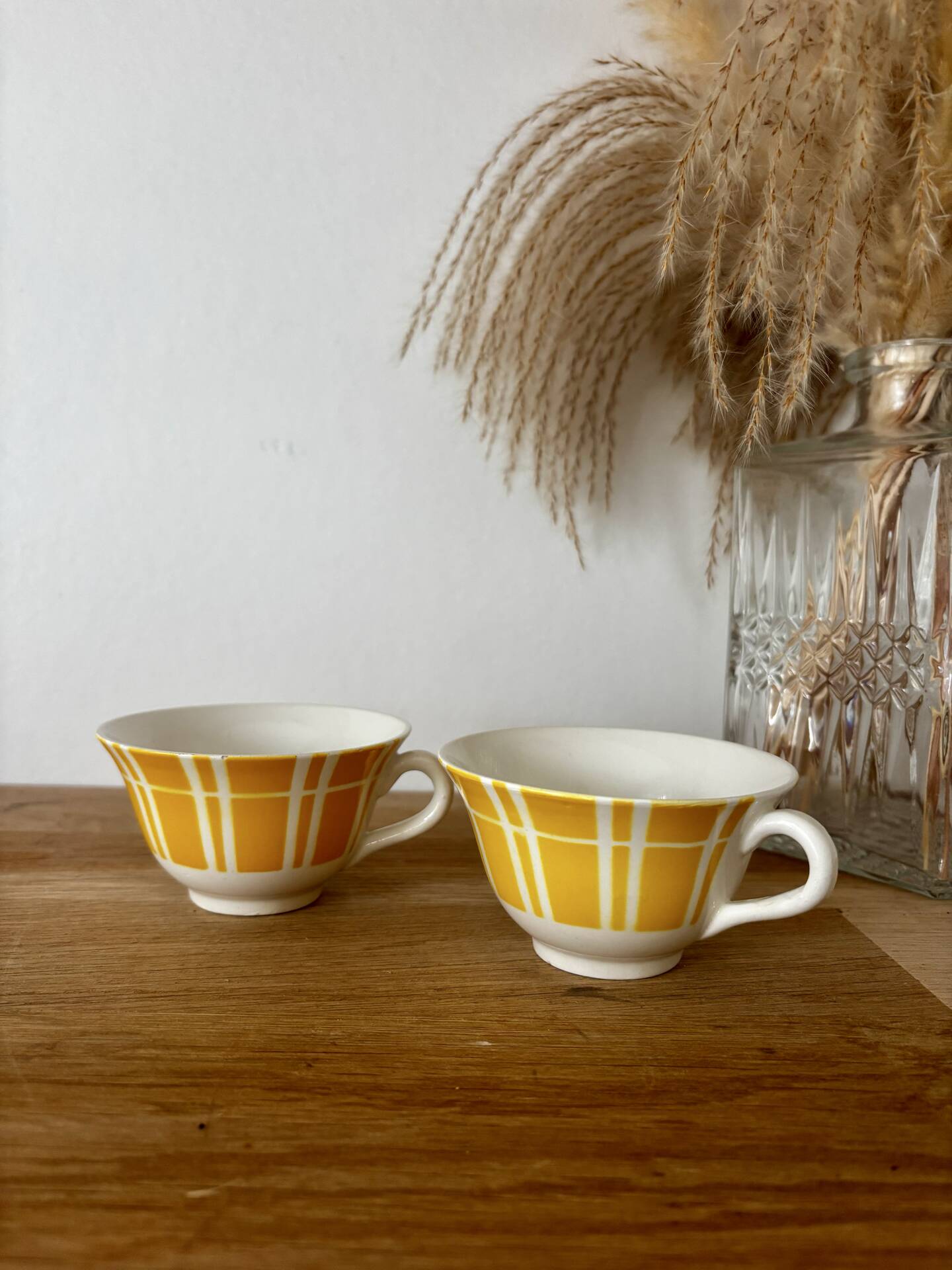 Set of two antique yellow Digoin Sarreguemines cups.