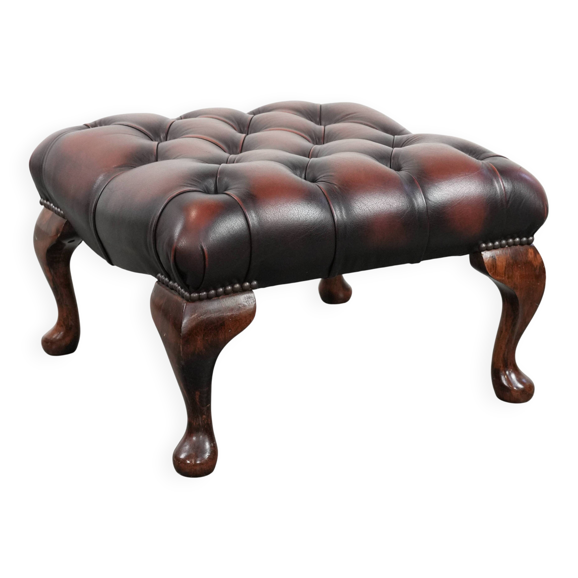 Dark brown chesterfield ottoman in cowhide leather