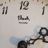 Wall clock plate flash transistor