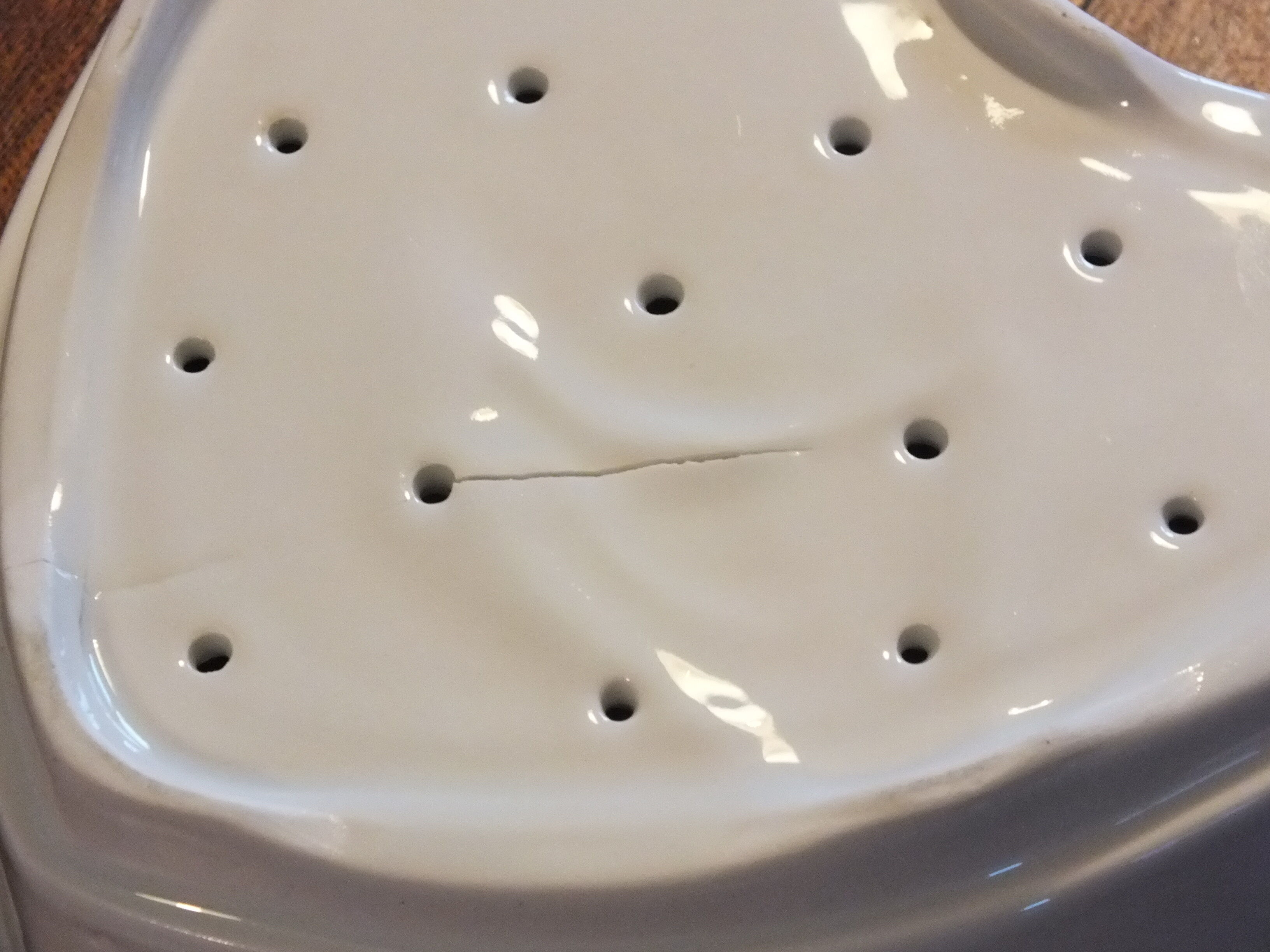 Old white porcelain heart mold (faisselle or Neufchatel)