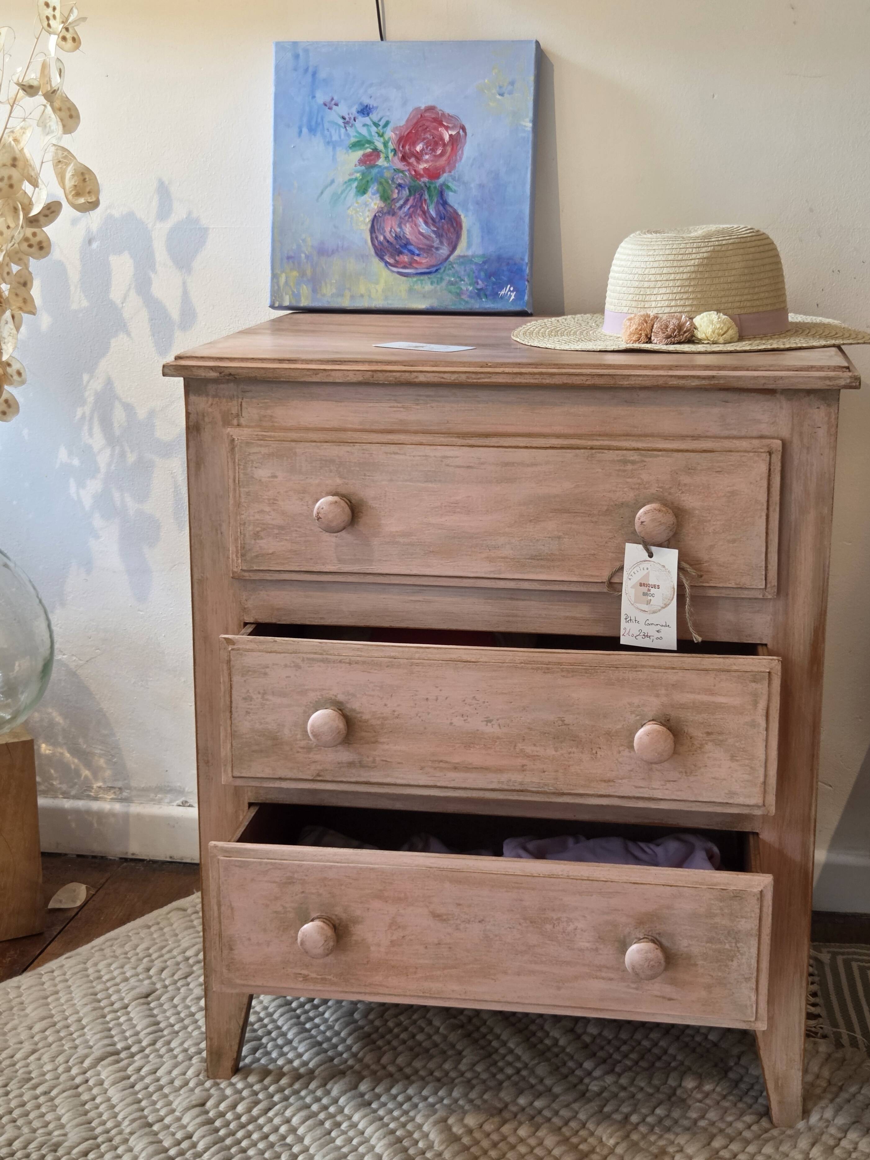 Small Parisian-style chest of drawers patinated in pink.