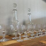 Engraved crystal service including 12 glasses and 2 carafes