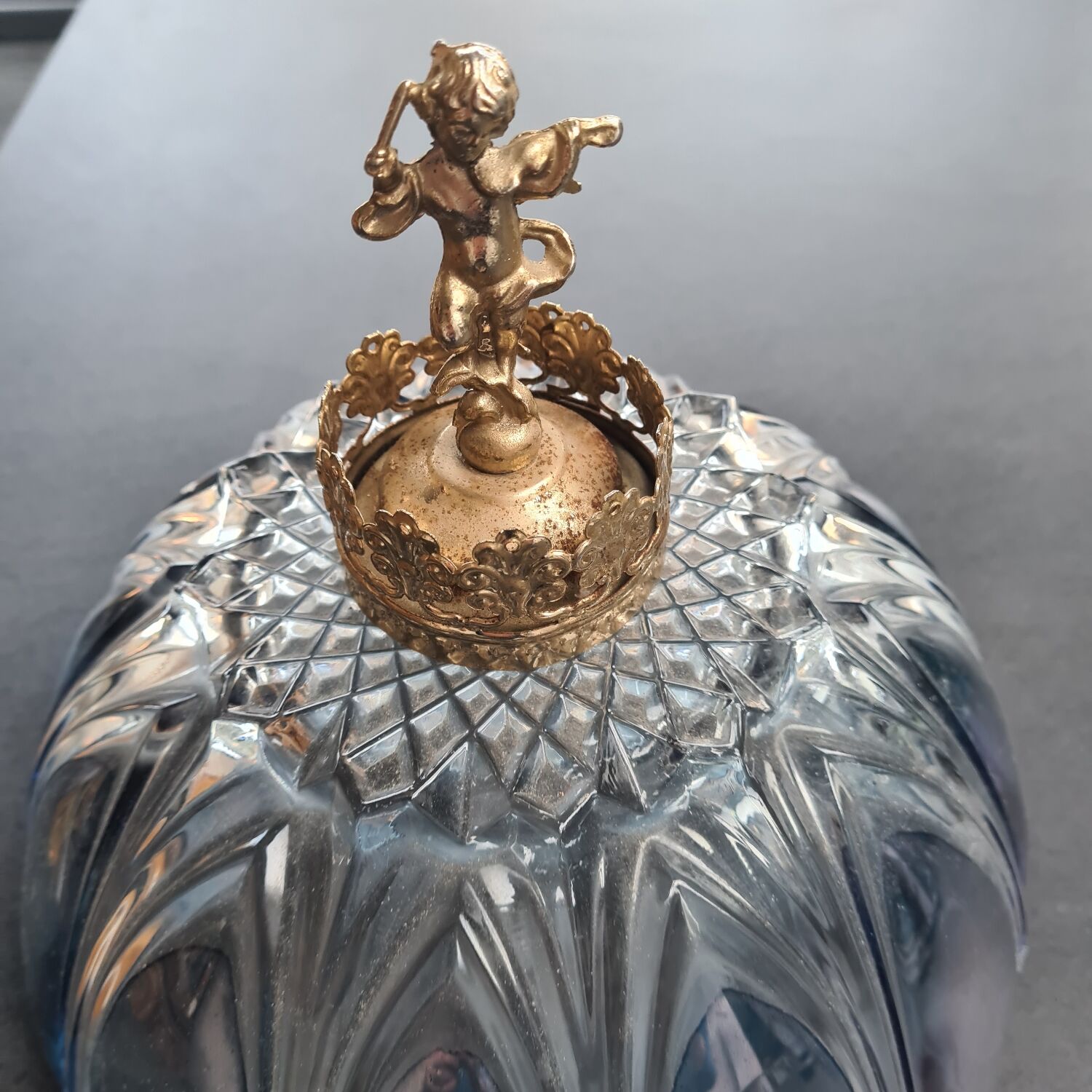 Glass lampshade with brass angel
