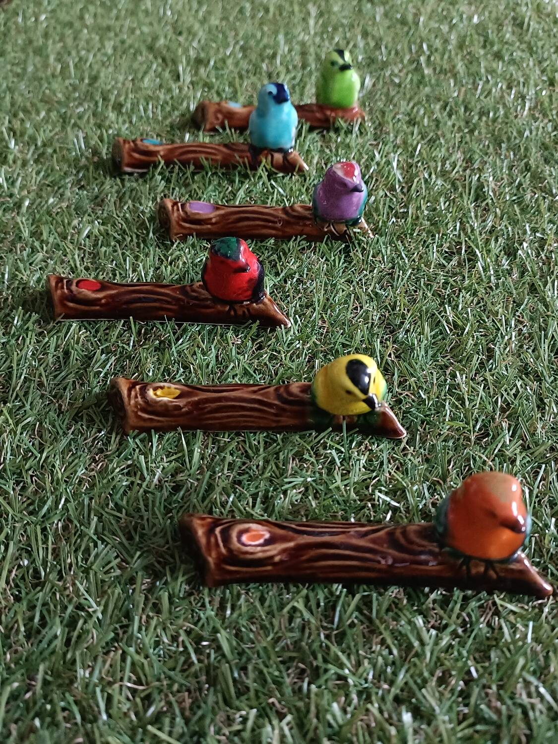 Set of six barbotine bird knife rests