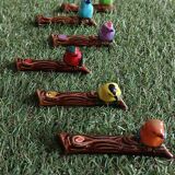 Set of six barbotine bird knife rests