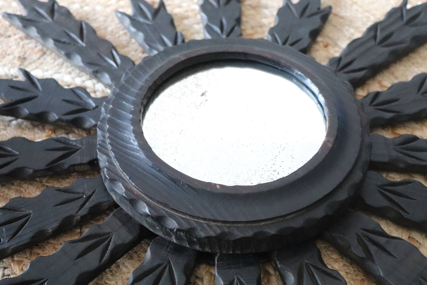 Antique black wooden sun mirror