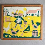 Wooden frame puzzle from the 1940s/50s depicting a farmer's wife.