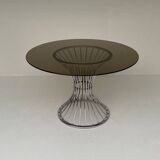 Space Age round dining table in chrome metal and smoked glass.