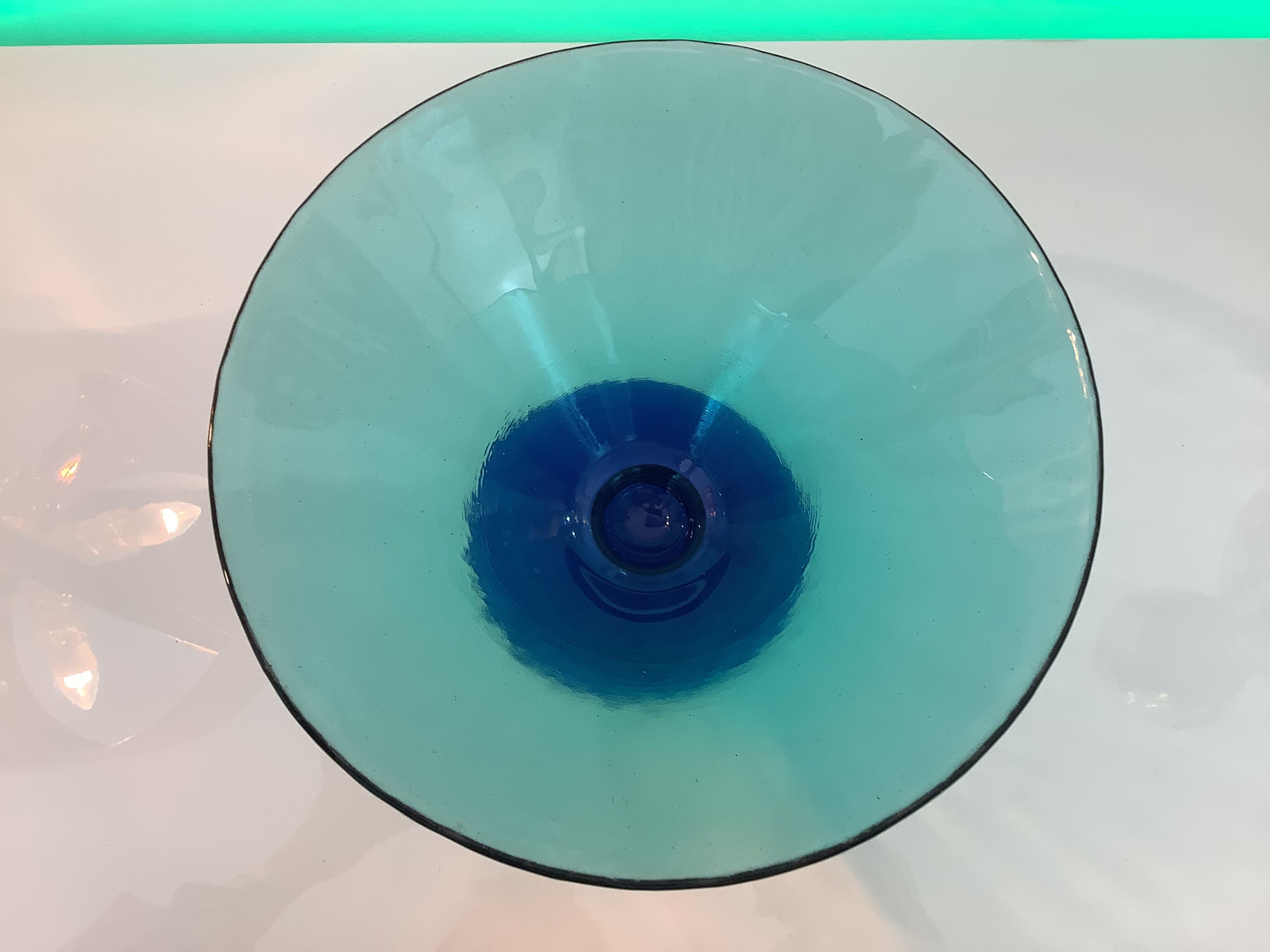 Glass fruit cup on foot, green and blue