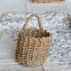 Small vintage woven fiber wall basket with handle