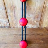 Wall coat rack in vintage red metal.