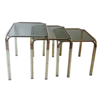 Series of nesting tables in smoked glass & rectangular golden brass