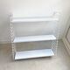 Tomado wall shelves designed by D. Dekker for TOMADO