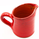 Bright red ceramic pitcher