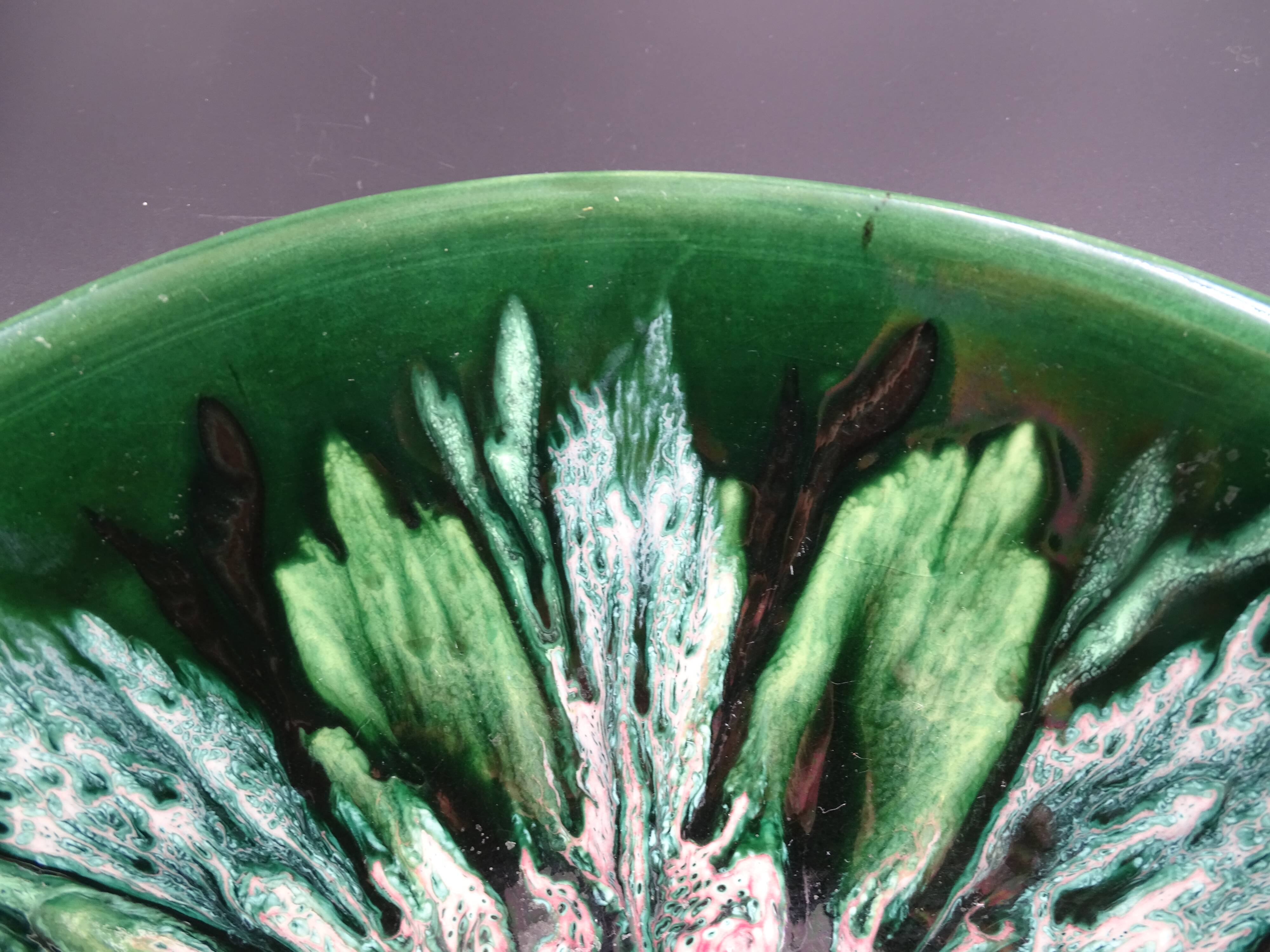 Green faience bowl decorated with multicolored drips around 1970