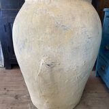 Yellow patinated cement grain jar