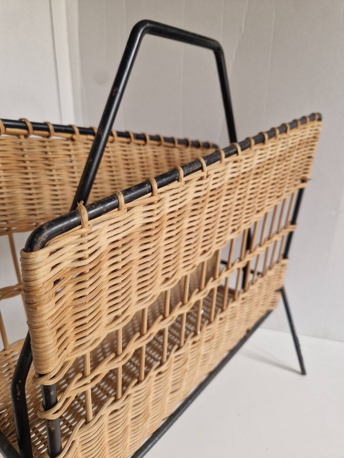 Raoul Guys magazine rack 1950s  
Rattan and black metal