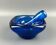 Mortar and pestle in the style of Biot, hard blue.