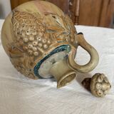Wine pitcher in stoneware motifs grapes in relief signed Denbac