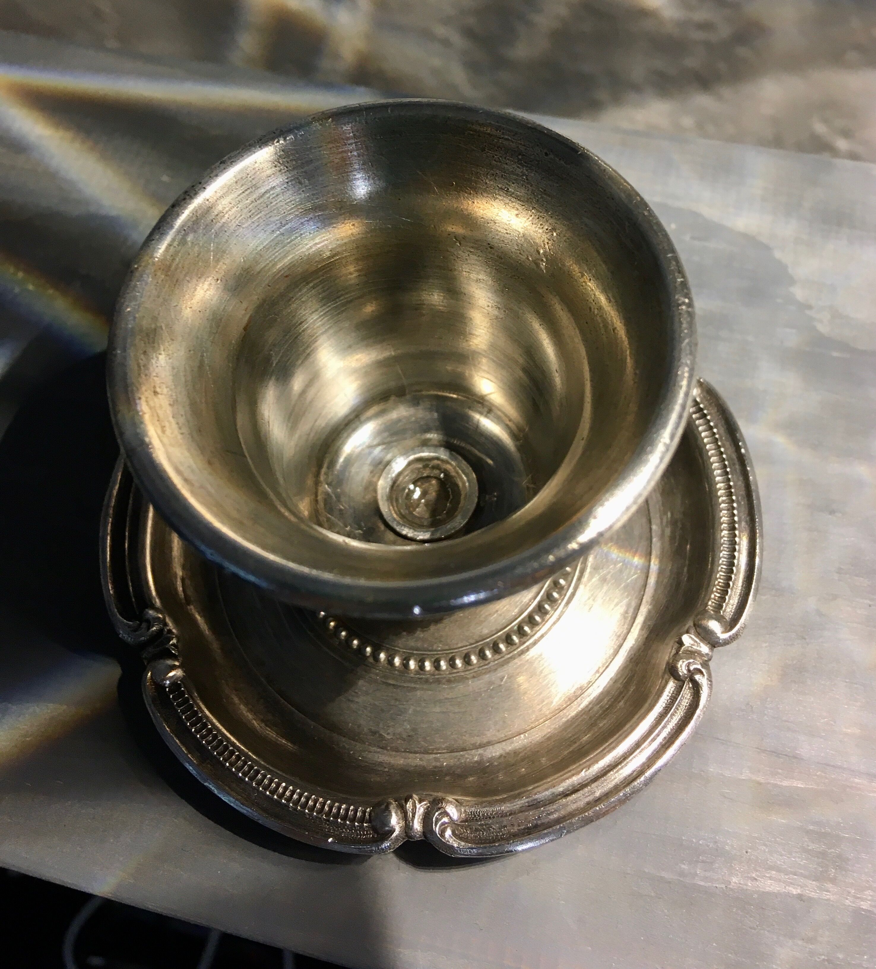 Chiseled silver metal candle holder